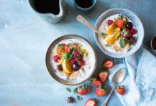 Two bowls of healthy food consisting of fibre fruits and carbs