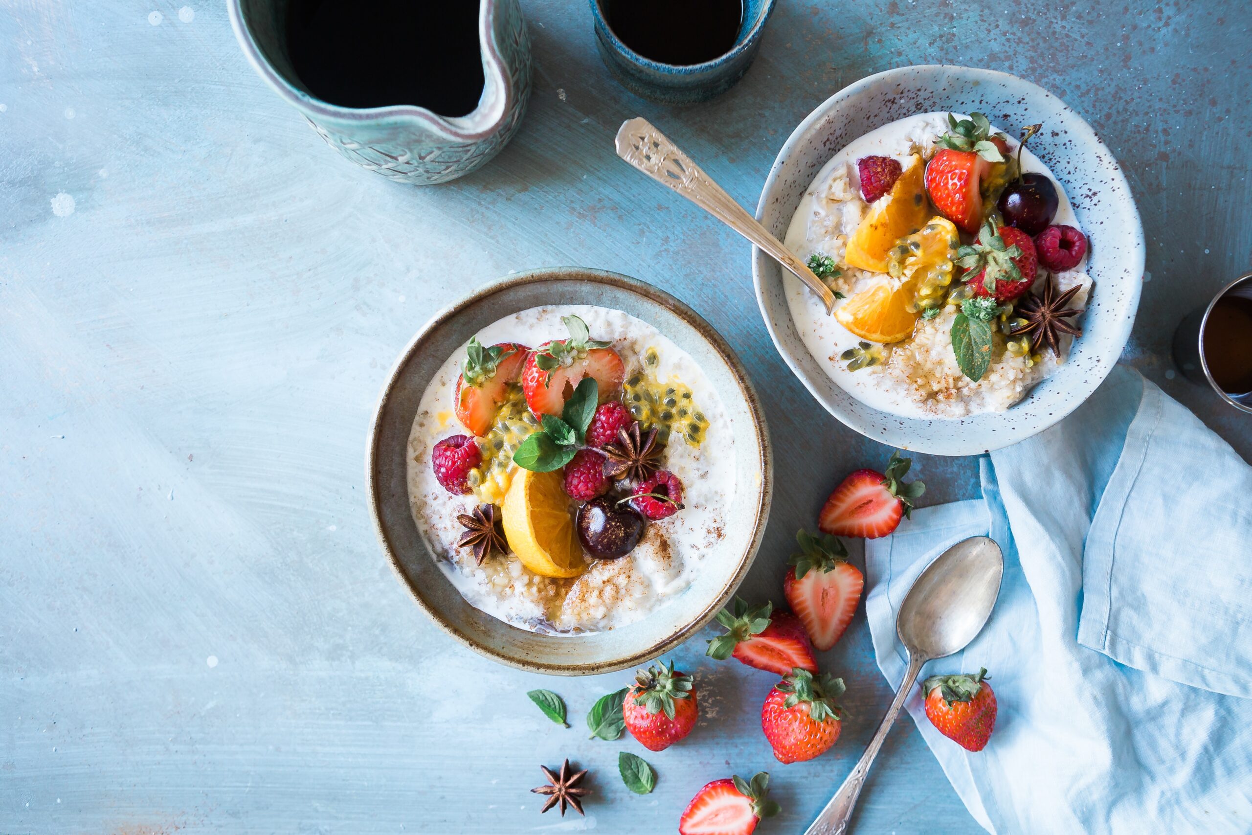 Two bowls of healthy food consisting of fibre fruits and carbs